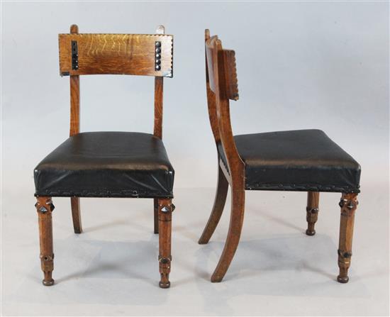 A set of four Victorian oak and ebonised dining chairs, manner of J.P. Seddon